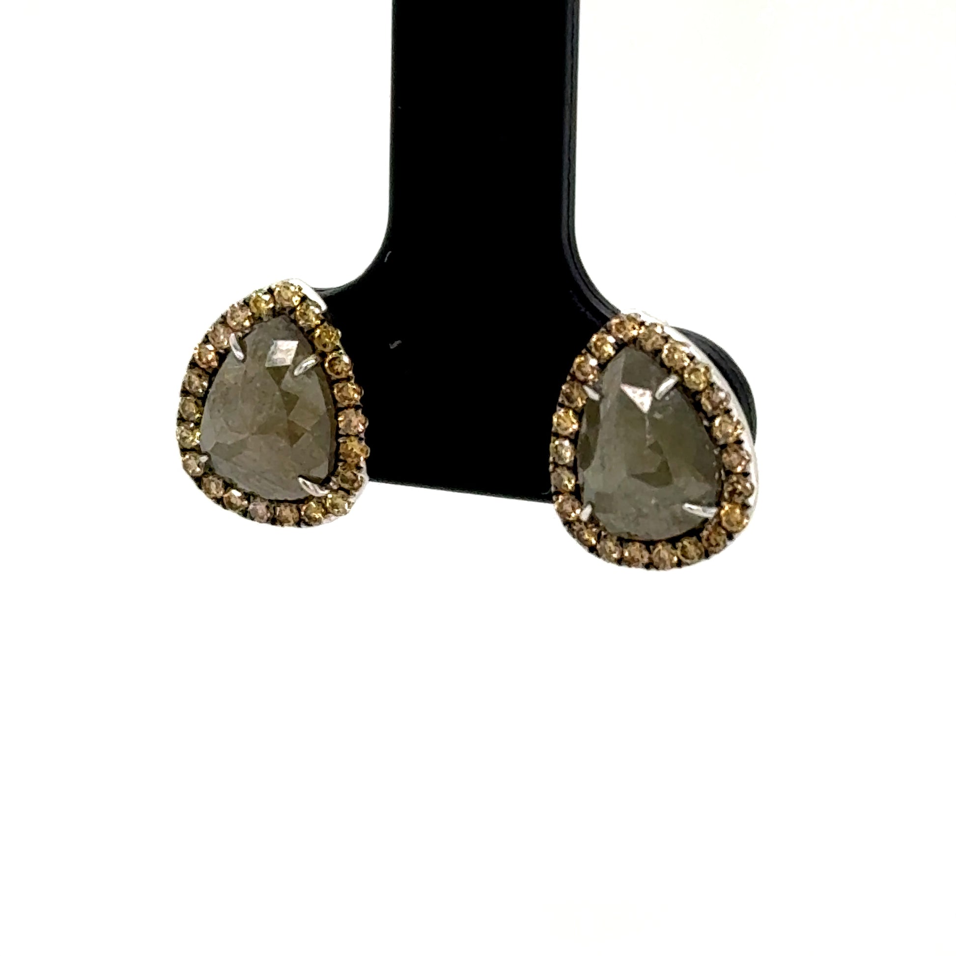 Pear-shaped slice diamond studs in 14K white gold with round diamond halos.
