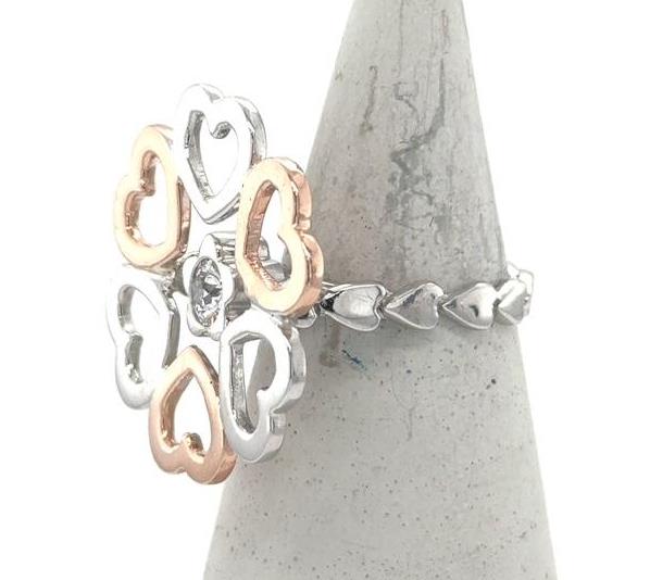 Two-tone 14K white and rose gold heart ring with bezel-set center diamond.