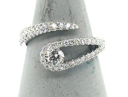 18K white gold bypass ring with pavé band and round center diamond.