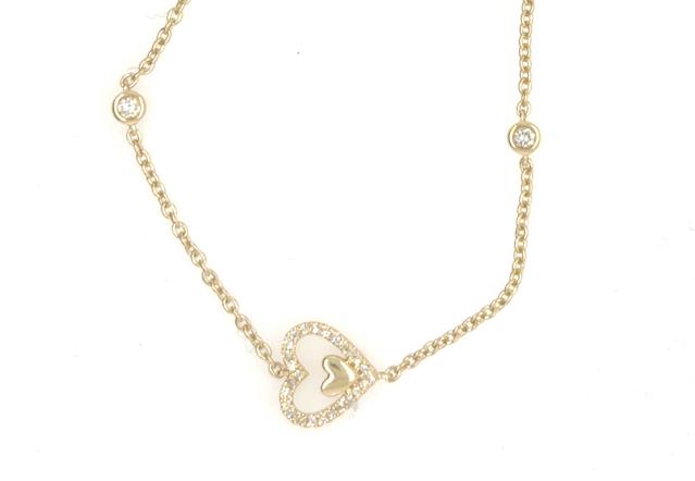 14K yellow gold bracelet with diamond pavé heart and two bezel-set diamond stations.