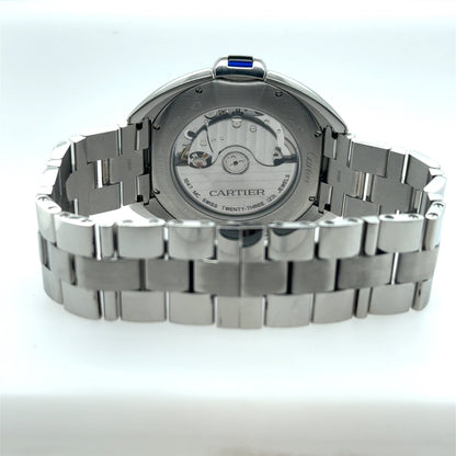 Stainless steel Cartier wristwatch showing exhibition caseback, automatic movement, and link bracelet.