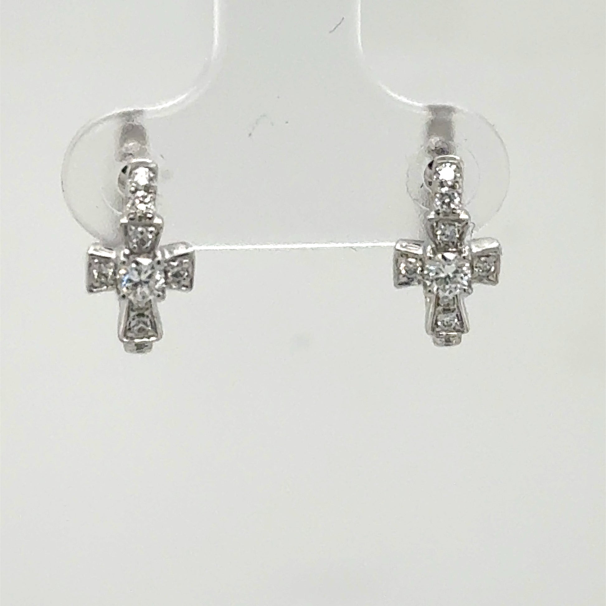 14K white gold huggie earrings with diamond cross charms, center stones highlighted.