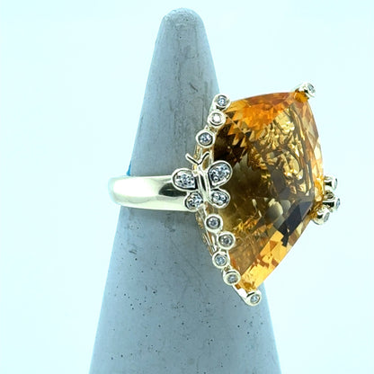 14K yellow gold ring with fantasy-cut citrine and diamond-accented butterfly prong.