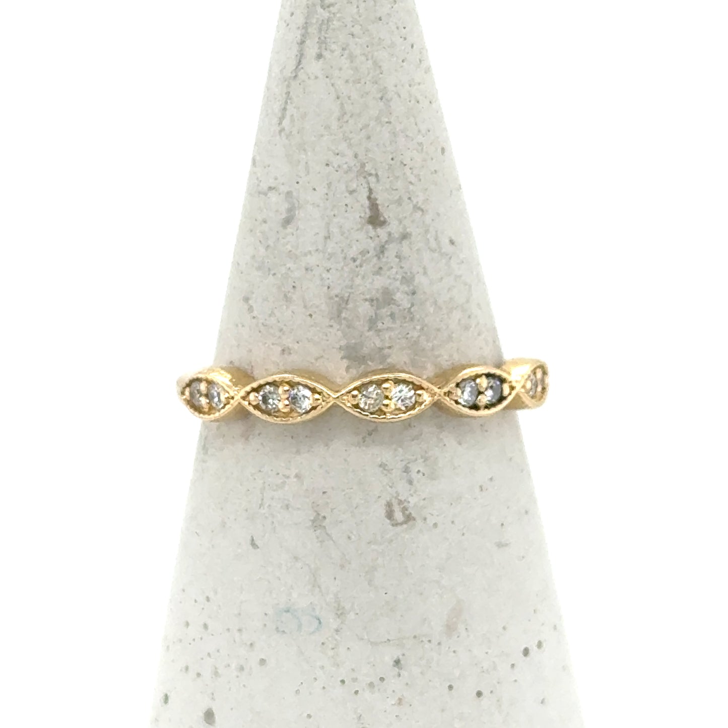 14K yellow gold stackable band with marquise-shaped stations set with round diamonds.