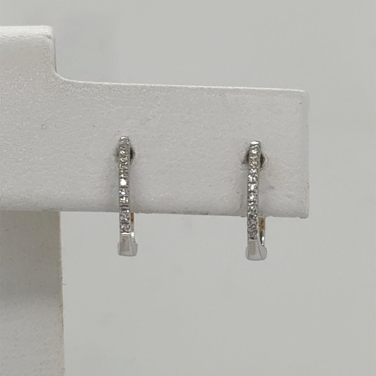 14K White Gold Diamond Huggie Earrings - 0.08ctw Round Cut