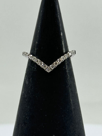 14K white gold chevron ring with pavé-set round diamonds on a V-shaped band.