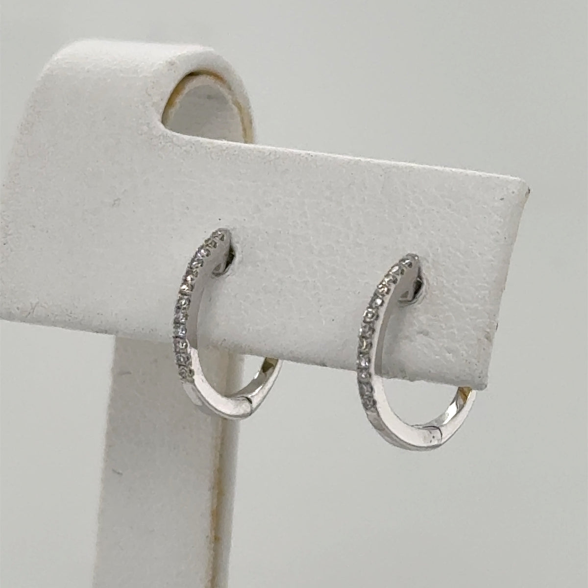 14K White Gold Diamond Huggie Earrings - 0.08ctw Round Cut