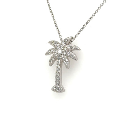 White gold palm tree pendant pavé-set with round diamonds on a fine chain.