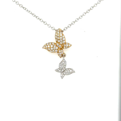 Two diamond-pavé butterfly pendants in yellow and white gold on a white gold chain.