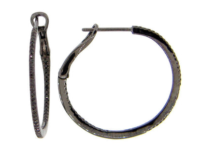 Inside-out hoop earrings in dark rhodium white gold with round black diamonds.