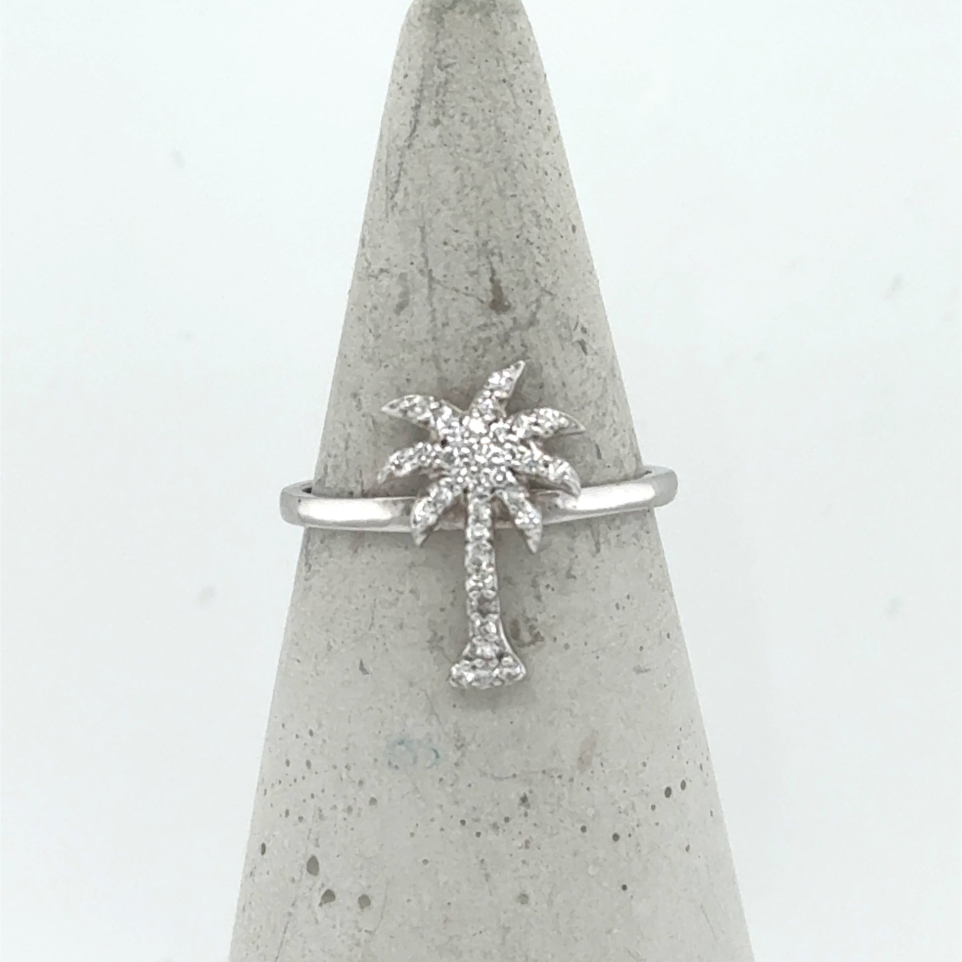 14K white gold ring with a pavé diamond palm tree motif on slim band.