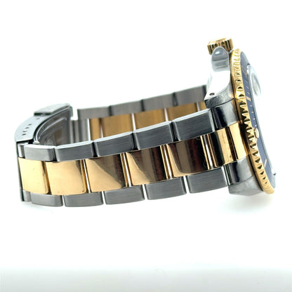 Two-tone stainless steel and yellow gold Submariner bracelet with Fliplock clasp and fluted bezel.