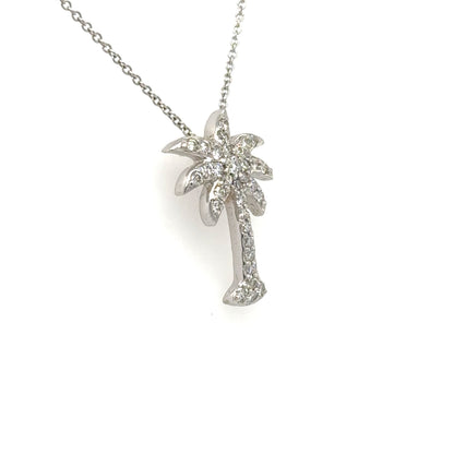 White gold palm tree pendant pavé-set with round diamonds on a fine chain.