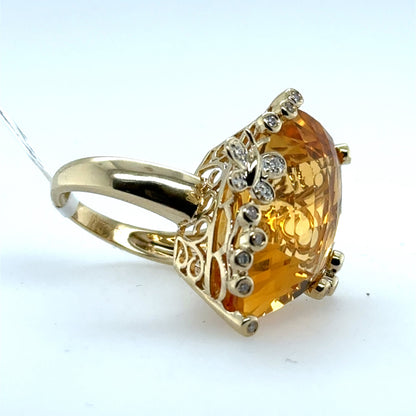 14K yellow gold ring with large fantasy-cut citrine and diamond-accented prongs.