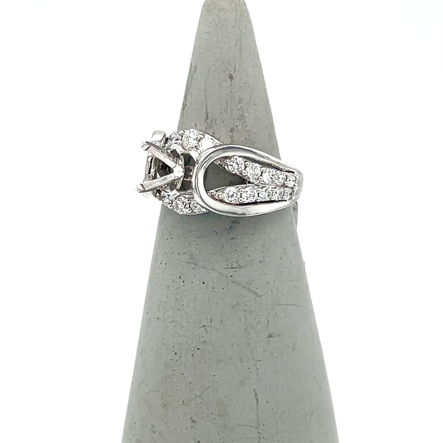 White gold semi-mount engagement ring with arch-shaped diamond-accented split shank.
