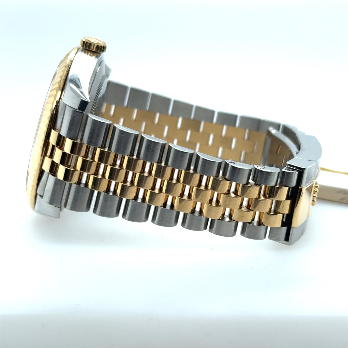 Two-tone stainless steel and yellow gold Jubilee bracelet with fluted bezel side view.