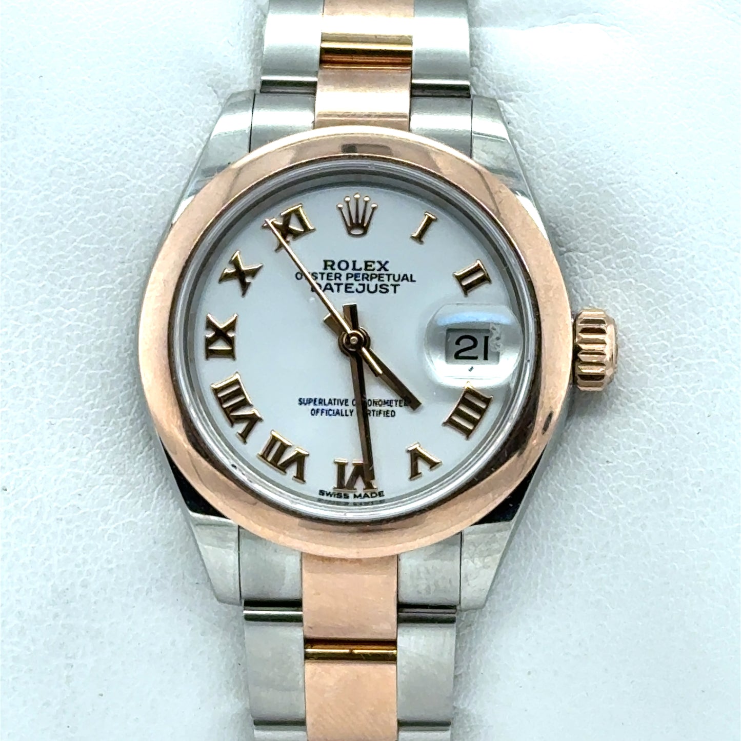 Two-tone stainless steel and rose gold Datejust with white dial, Roman numerals, date window.