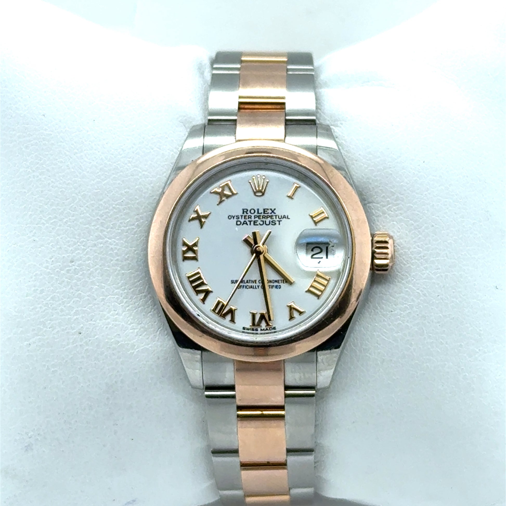 Rolex Datejust 28mm in steel and rose gold, white dial, Roman numerals, date.