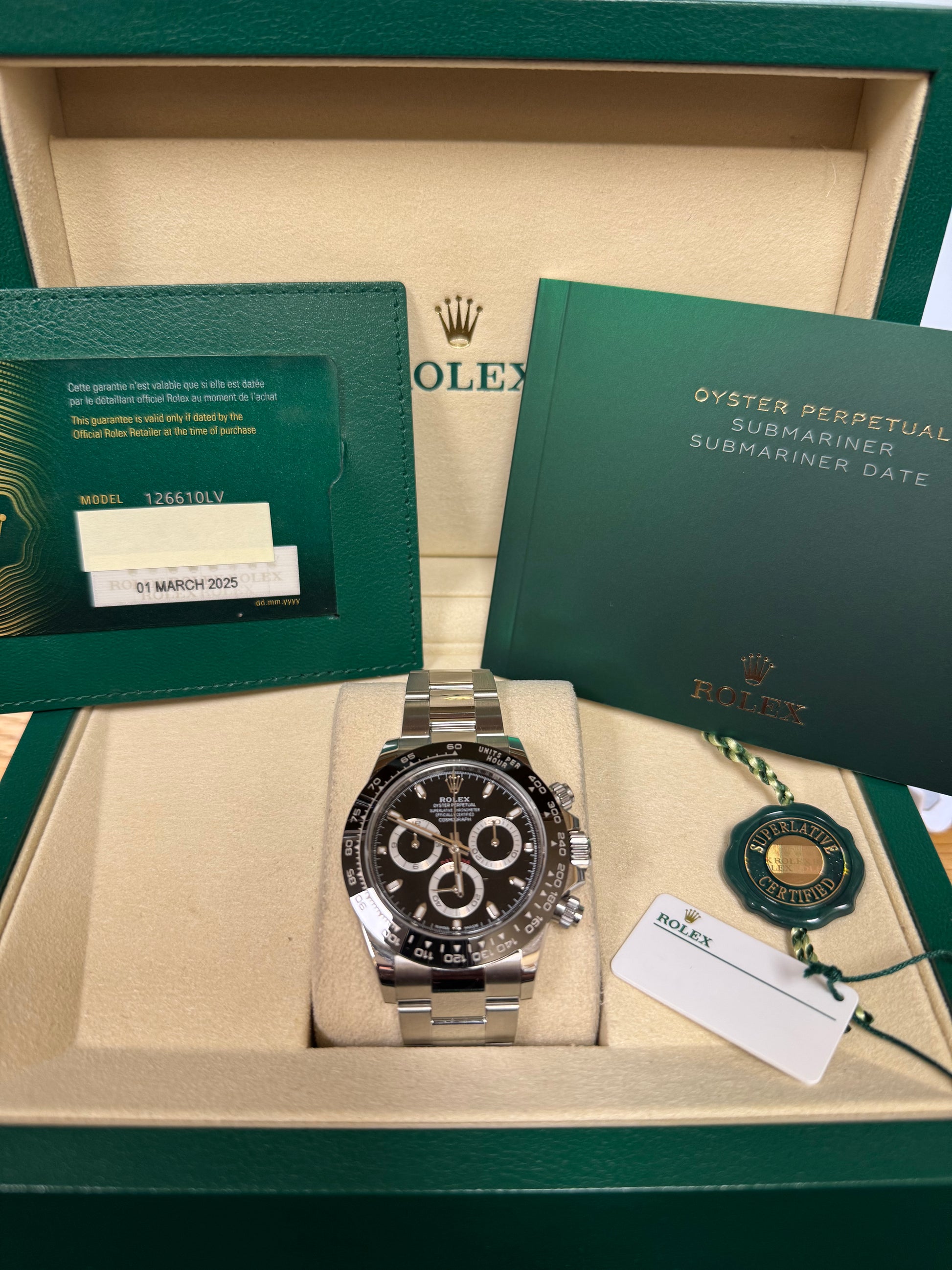 Stainless steel Rolex Daytona 40mm with black dial, ceramic bezel, oyster bracelet, in box.