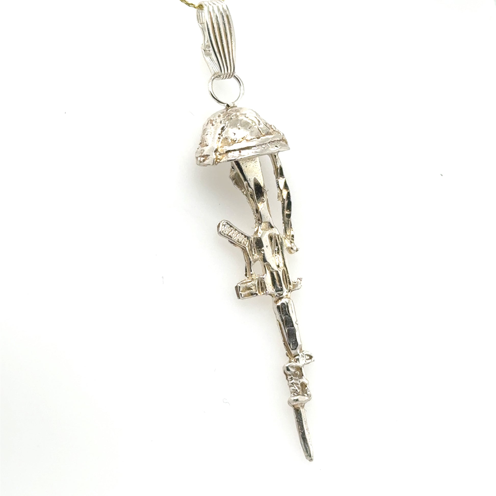 Sterling silver pendant depicting a battlefield cross with helmet, rifle, and boots.