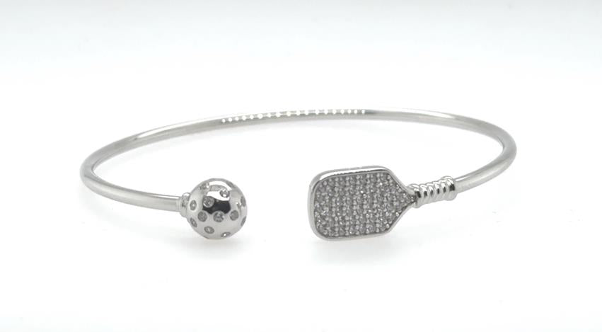 Sterling silver open cuff bracelet with CZ paddle and perforated pickleball ends.