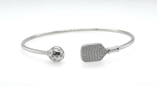 Sterling silver open cuff bracelet with CZ paddle and perforated pickleball ends.