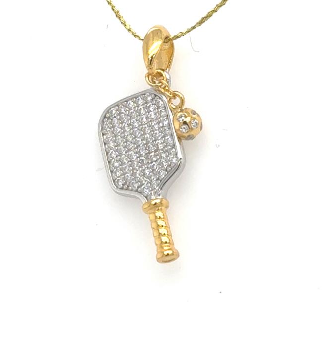 Gold vermeil pickleball paddle pendant with pavé cubic zirconia and dangling ball.