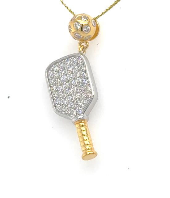 Two-tone pickleball paddle pendant with pavé cubic zirconia and gold-tone handle.