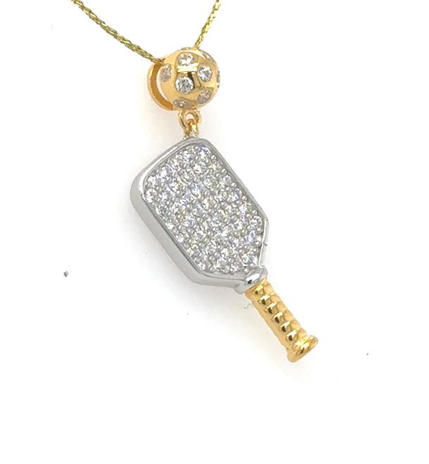Two-tone pickleball paddle pendant with pavé cubic zirconia and gold-tone ball.