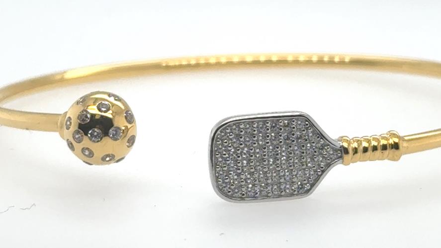 Gold vermeil open cuff bracelet with CZ pickleball and pavé paddle ends.