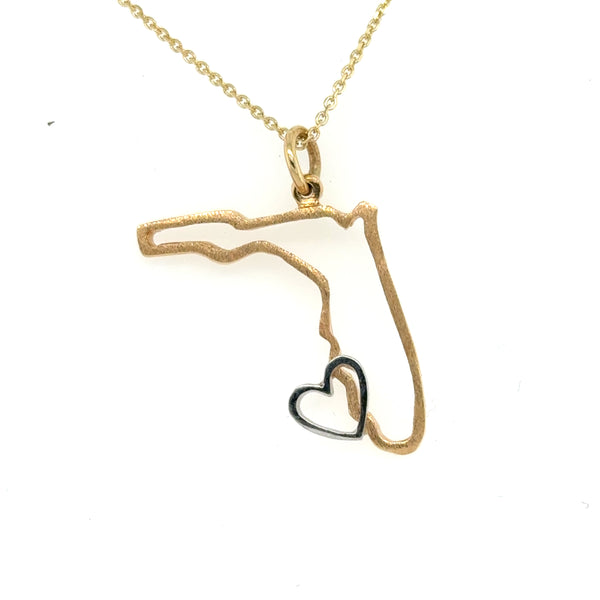 14K yellow gold Florida outline pendant with small white gold heart charm.