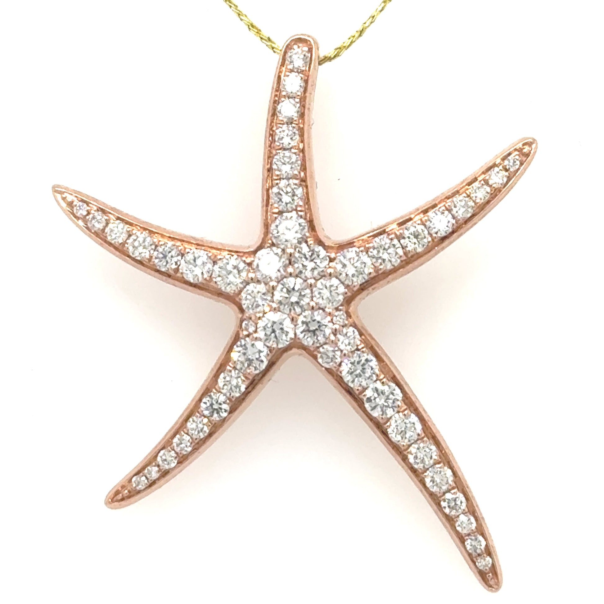 Rose gold starfish pendant pavé-set with round diamonds, hidden bail back.