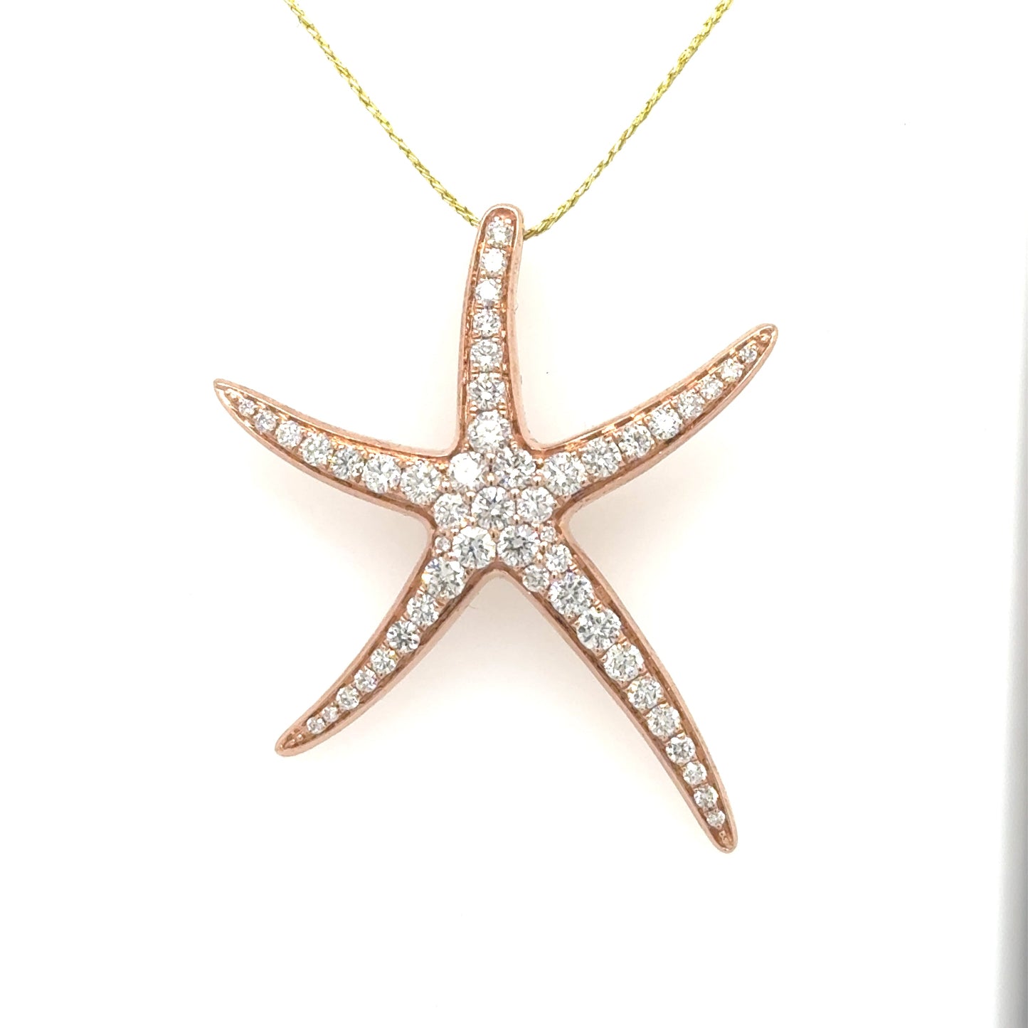 Rose gold 14K starfish pendant pavé-set with round diamonds, hidden bail.