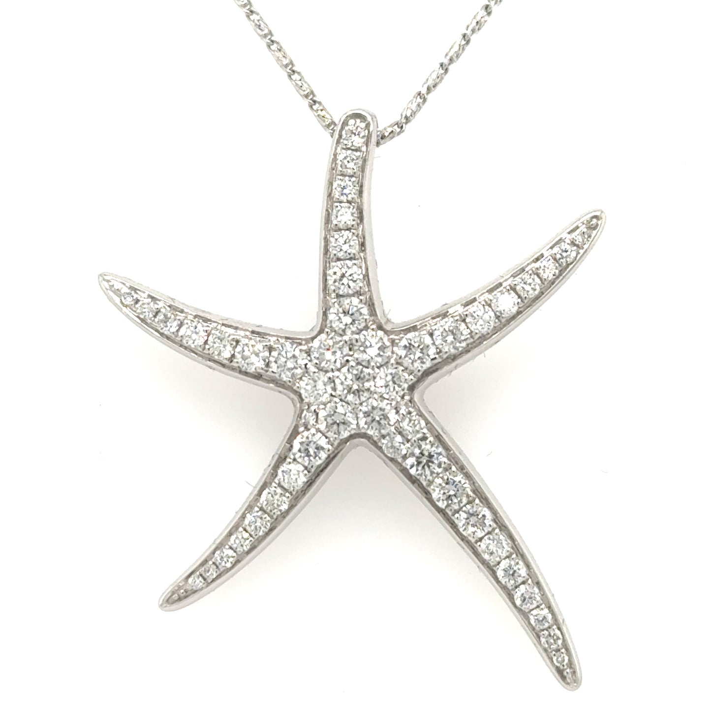 White gold starfish pendant pave-set with round diamonds, hidden bail, no chain.