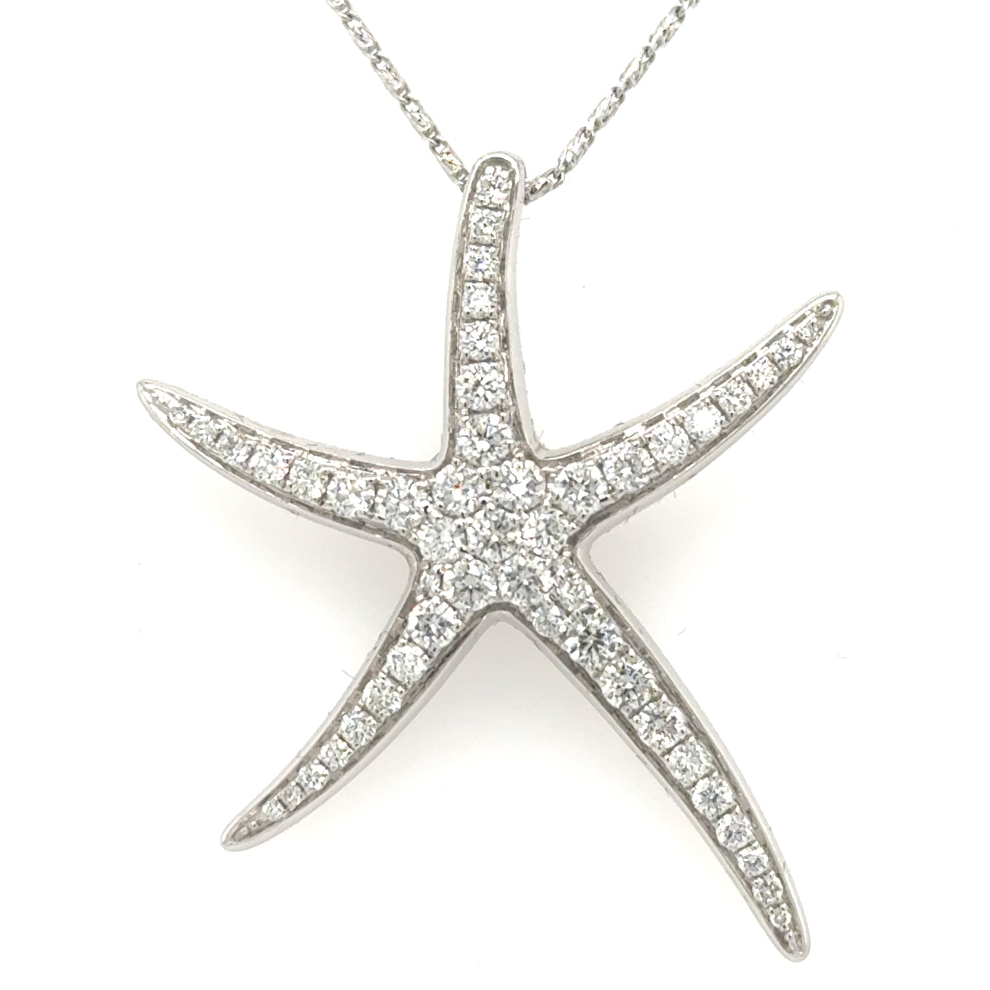 White gold starfish pendant pave-set with round diamonds, hidden bail, no chain.