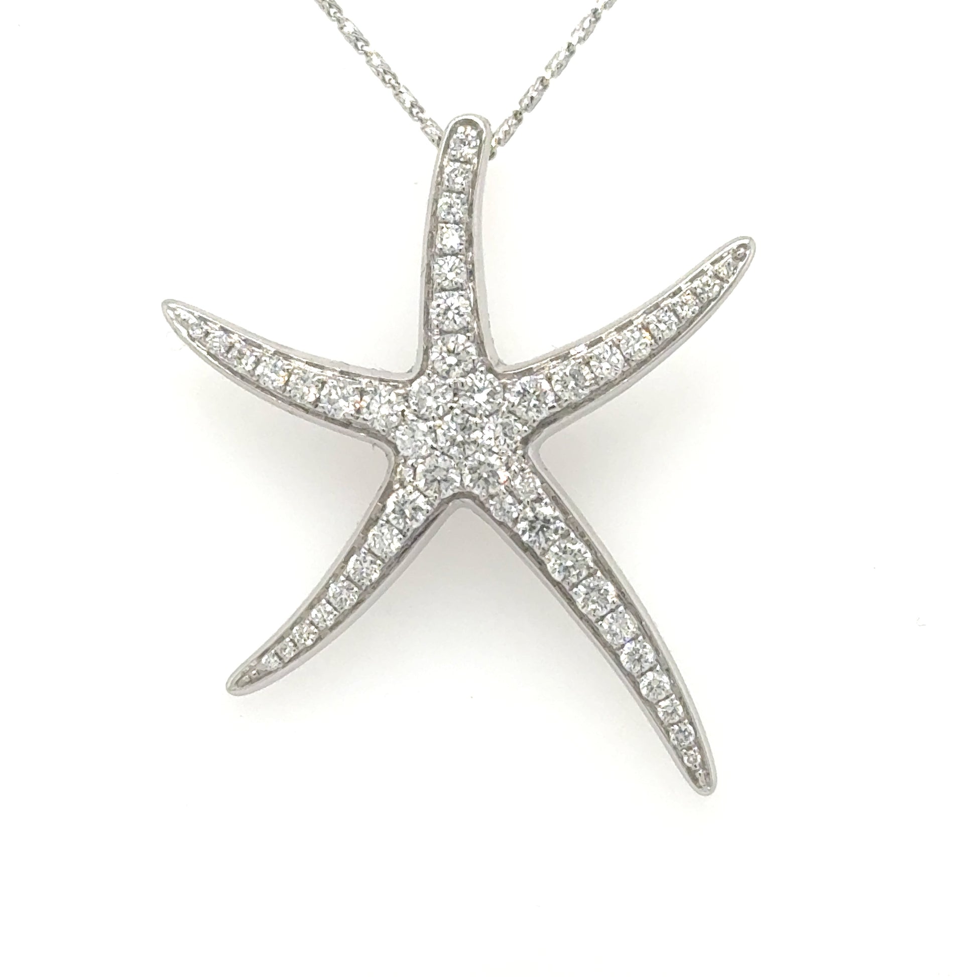 14K white gold starfish pendant pavé-set with round diamonds, hidden bail.