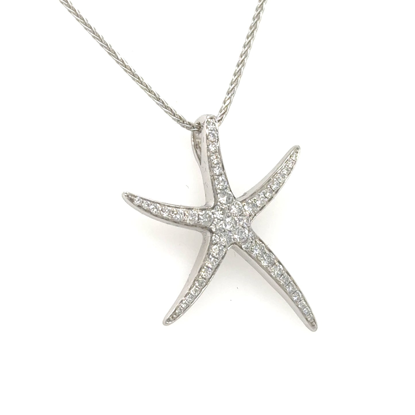 14K white gold starfish pendant pavé-set with round diamonds on hidden bail.